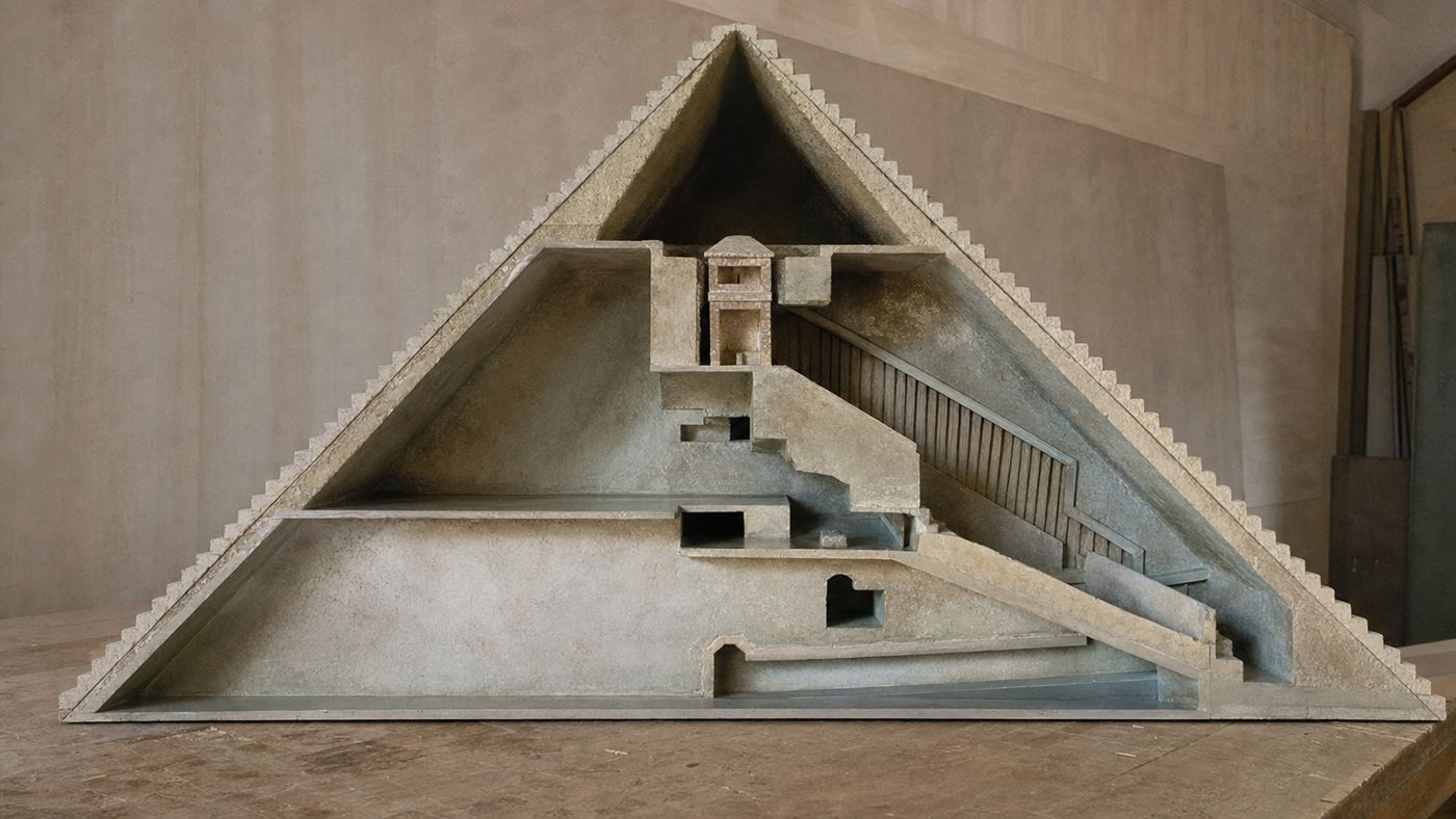 Model of a pyramid, one half open as a cross-section showing the chambers