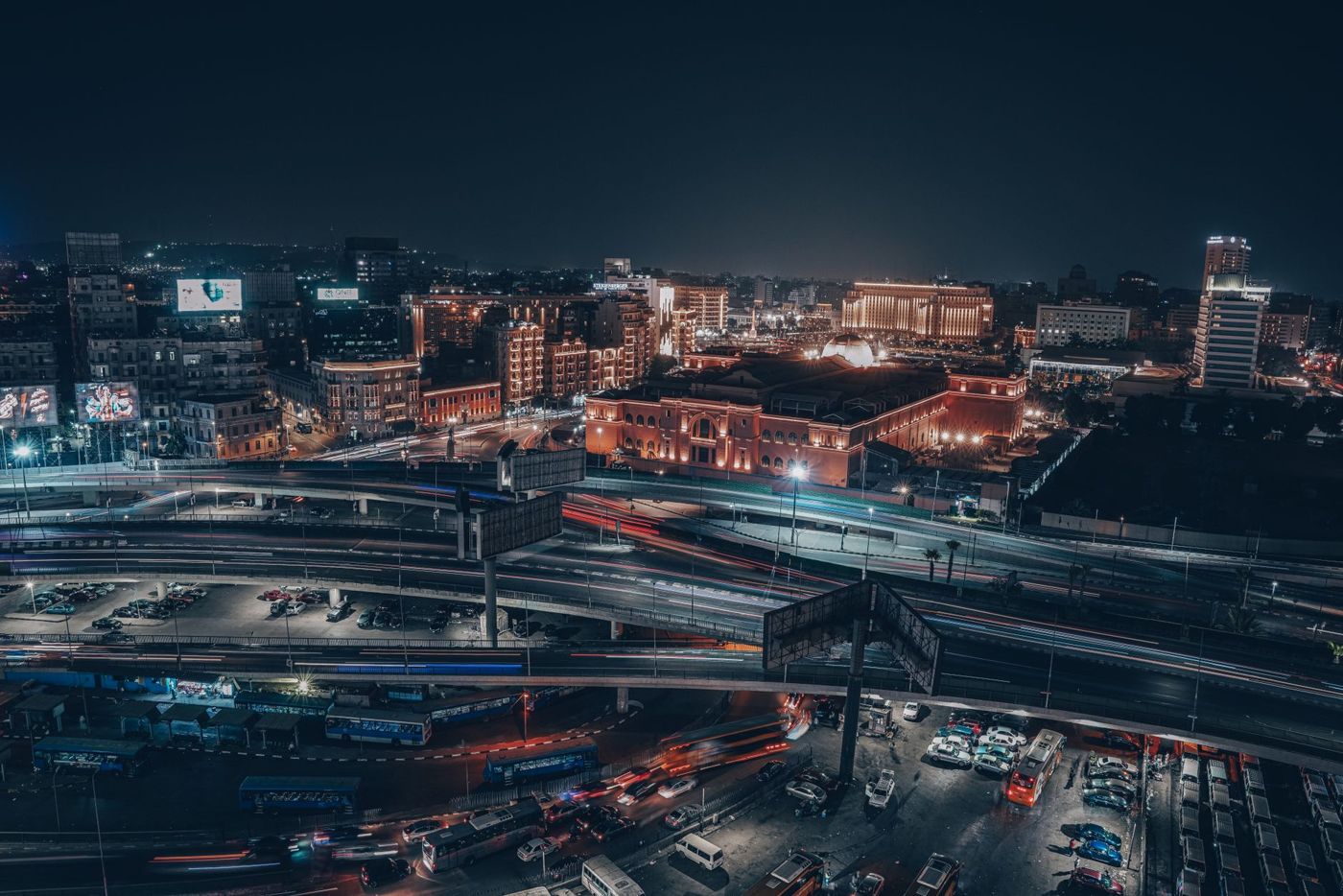 Heavy traffic on a multi-lane road in Cairo with a view toward Giza