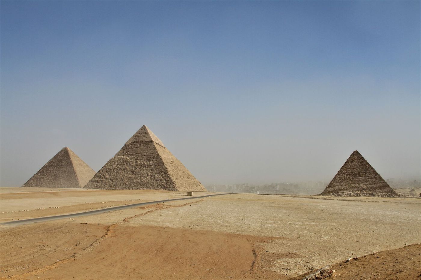 The Giza Plateau shortly after opening, only a few visitors in the distance