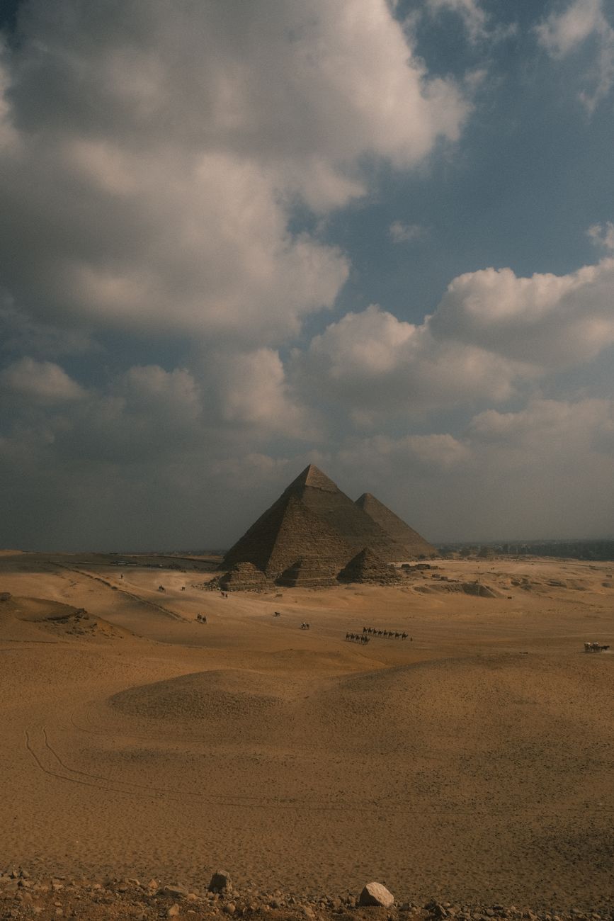 Desk with open sources, notes, and a map of the Giza Plateau