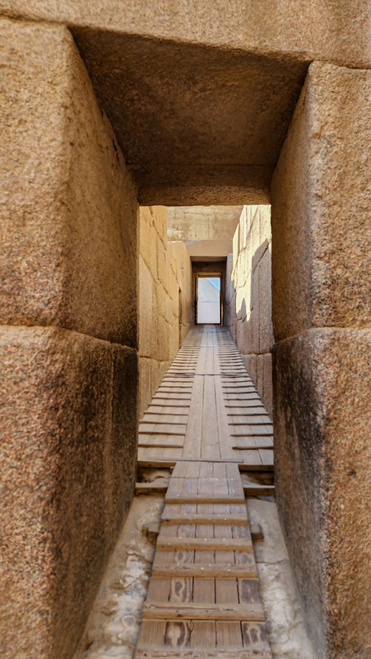 The narrow Ascending Passage in the Great Pyramid of Khufu with wooden planks and cross battens