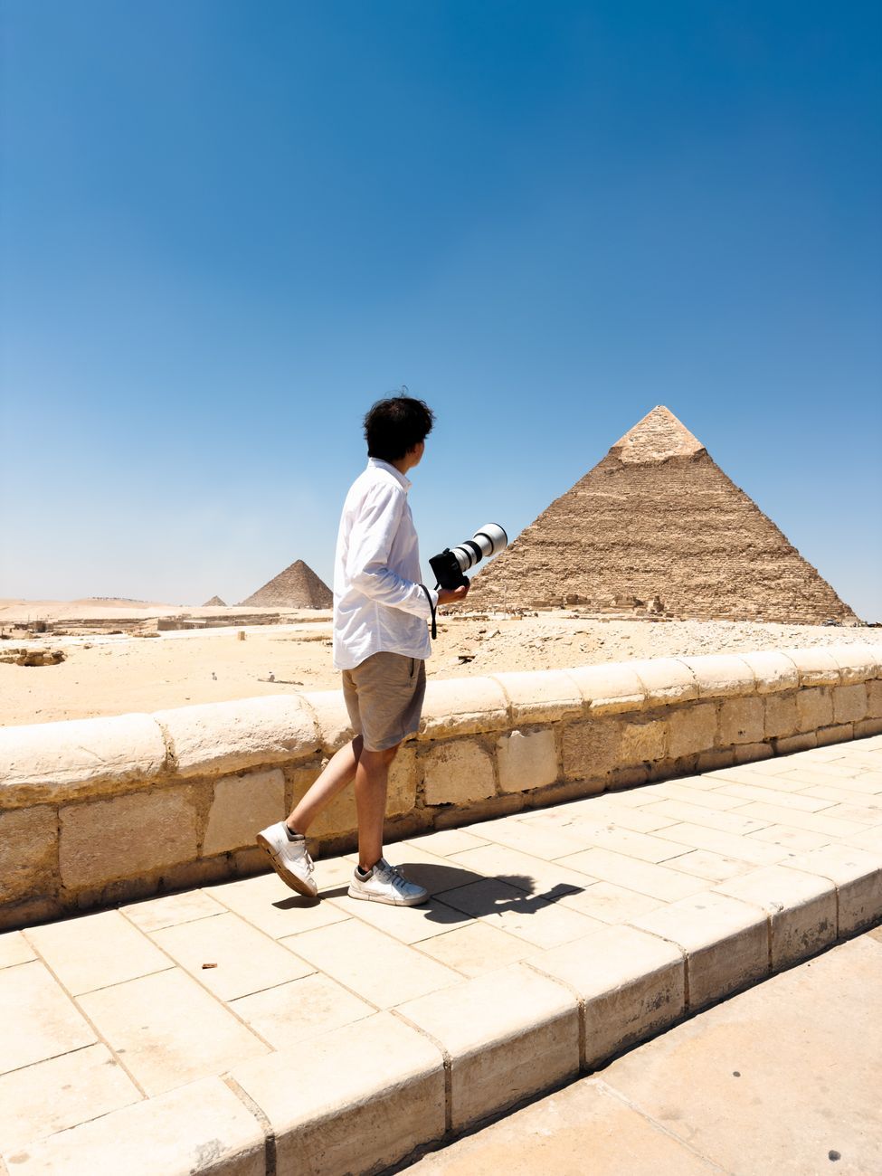 Single visitor early in the morning at the north side of the Great Pyramid of Khufu