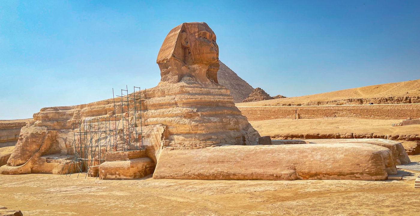 The Great Sphinx in its enclosure, with open desert behind