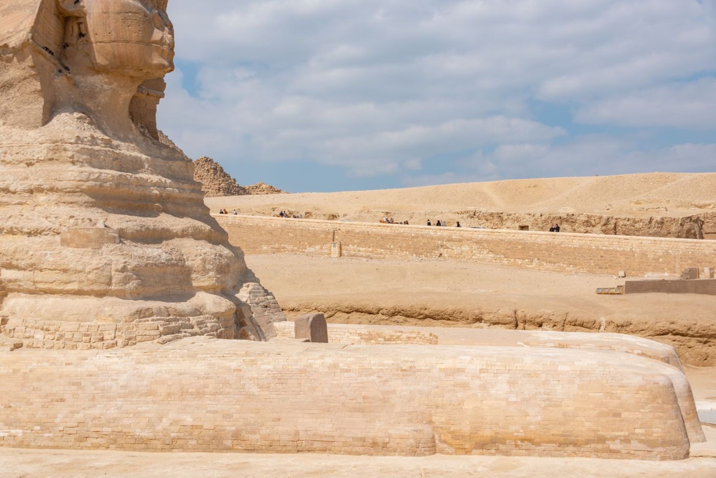 Visitors on the viewing terrace east of the Sphinx, with the Pyramid of Khafre behind it