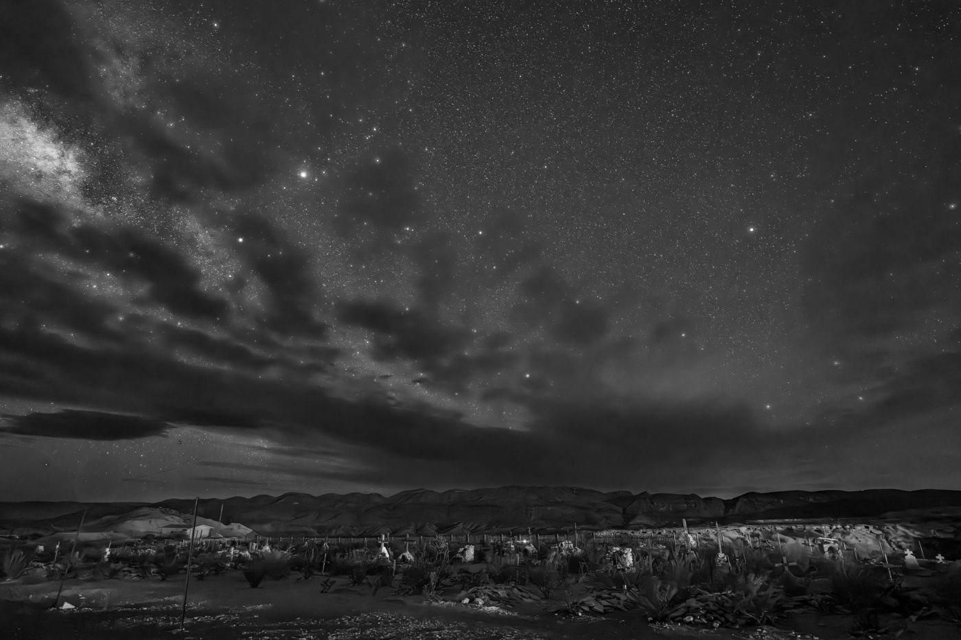 The night sky over the desert with the constellation Orion